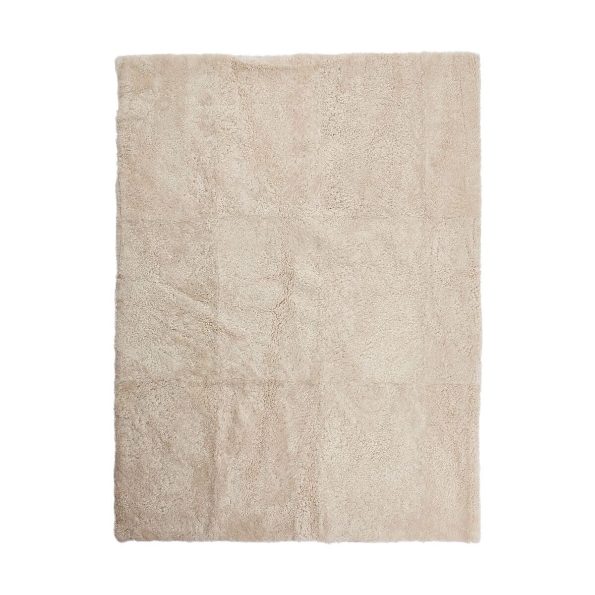 Tapis design en peau de mouton bouclée à laine courte Perle