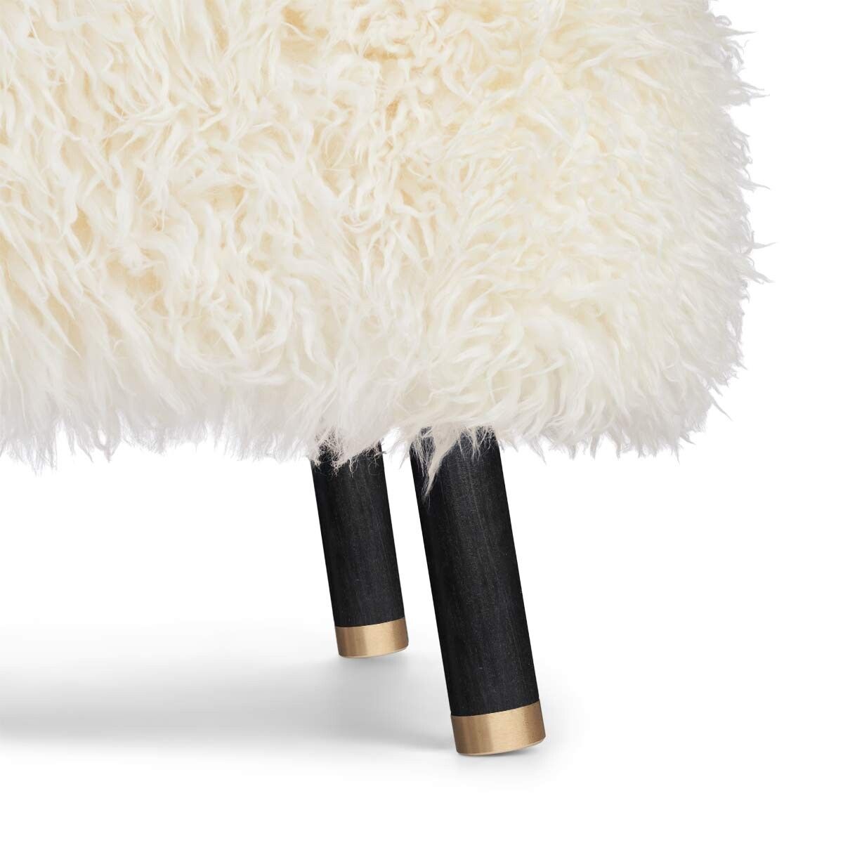 Fautieuil Emil en peau de mouton à laine longue Blanche-Neige