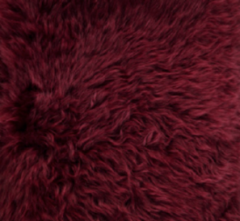 Pouf rond en peau de mouton à laine longue Bordeaux