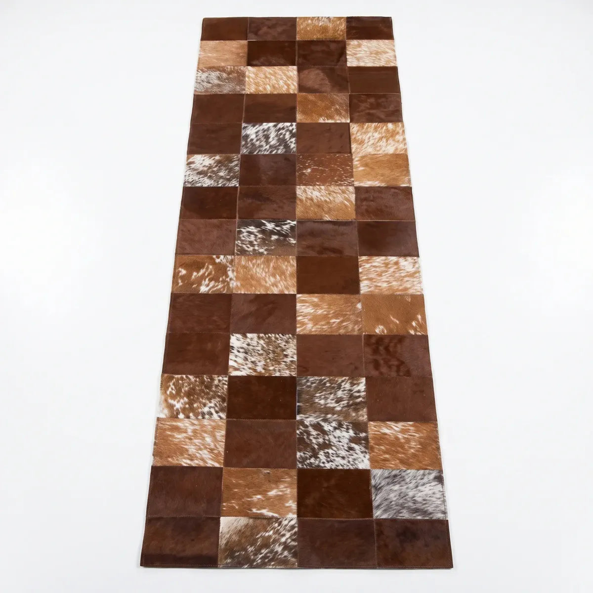 Tapis design en peau de vache Marron
